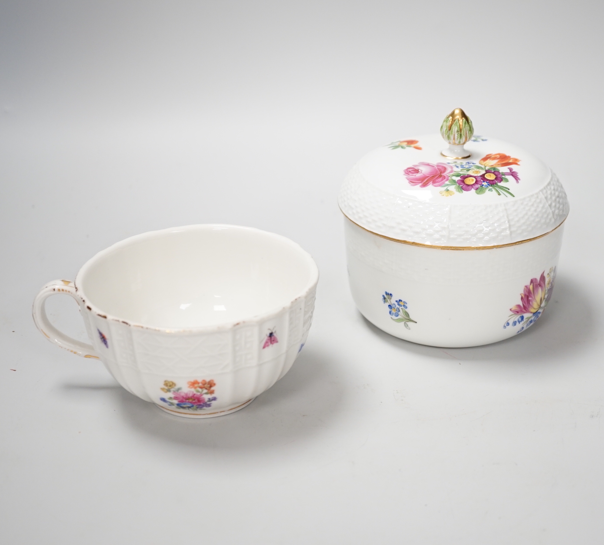 Five late 19th century Meissen breakfast cups and a sugar bowl and cover